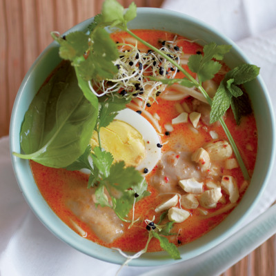Fragrant laksa with toasted cashews and fresh herbs