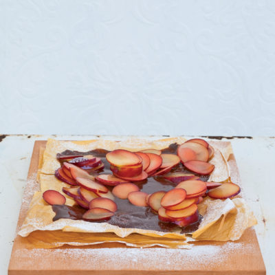 Phyllo pastry sheets smothered in rich chocolate ganache and topped with plum slivers