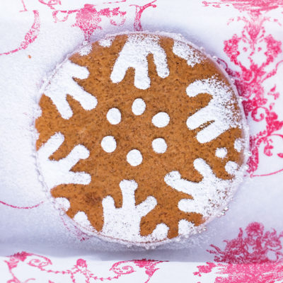 Oversized gingerbread biscuits with snowflake dusting