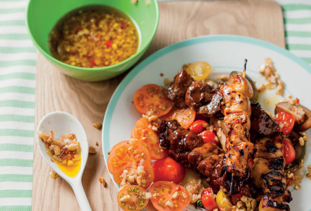 Kebabs with tomato salad and roasted garlic and peanut dressing recipe