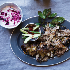 Slow-roasted lamb shoulder with beetroot-swirled tzatziki and pickled mini-cucumbers