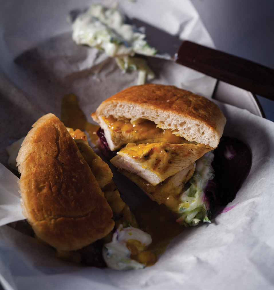 Grilled chicken burgers with tzatziki, mango chutney and beetroot