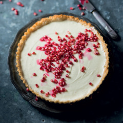 Pomegranate studded no-bake cheesecake with a coconut crust