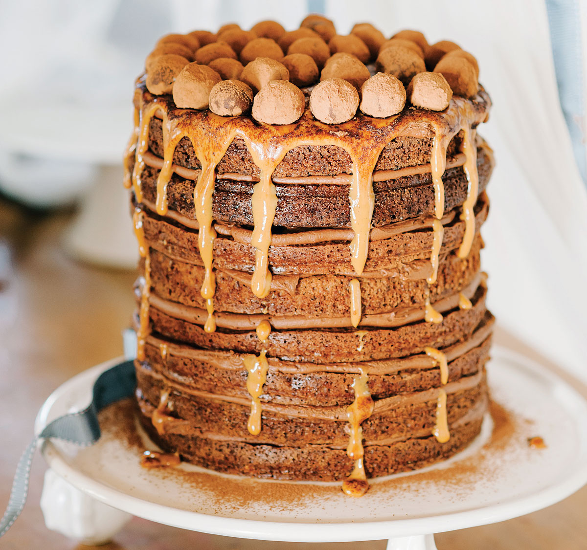 Eight layer mississippi mud cake with caramel drizzle and