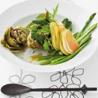 Artichoke and pear summer salad with fresh greens tossed in a smoked white-balsamic reduction