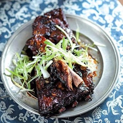 Asian treacle-sugar ribs with spring onion curls