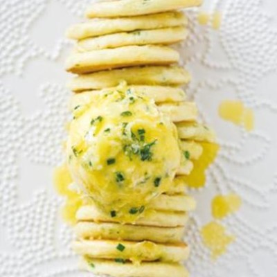 Baby chive blinis with pineapple and chive infused butter