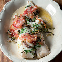 Baked hake with crisp pancetta and anchovies