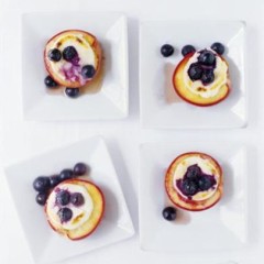 Baked organic nectarines with cream cheese, maple syrup and blueberries