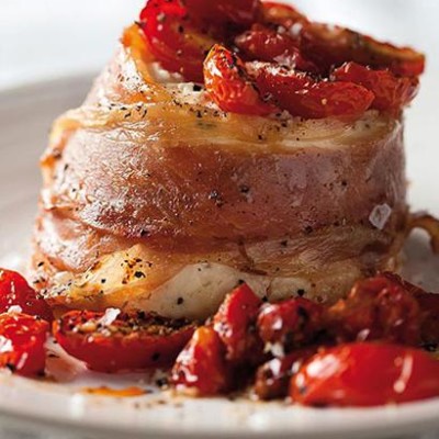 Baked ricotta with cherry tomatoes and parma ham
