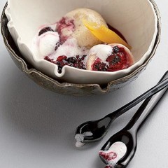Berry-walnut dumplings with stewed berries and frothy cream