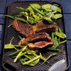 Chargrilled sirloin steaks with crisp greens tossed in a spicy dressing