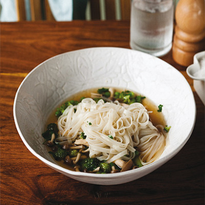 Chicken and vegetable broth with rice noodles