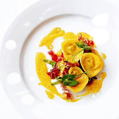 Confit of rabbit and green olive in saffron tortellini