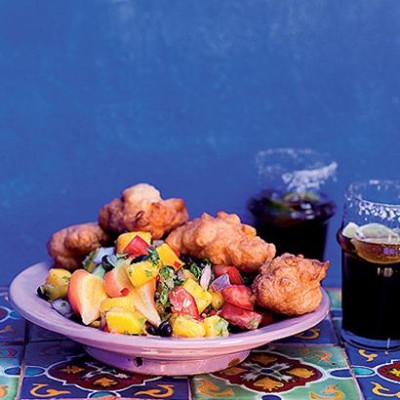 Corn fritters with mango-and-black bean salsa served with Mexicola