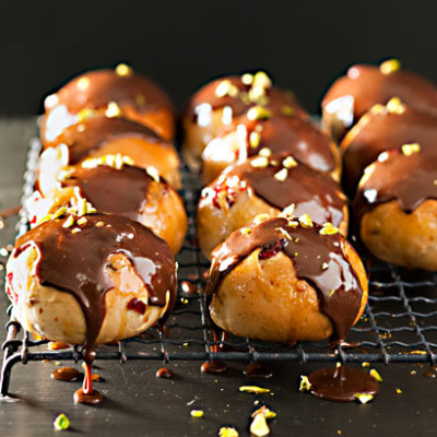 Cranberry and orange hot cross buns with milk chocolate drizzle
