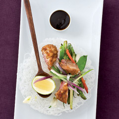 Crispy tamarind and palm-sugar duck breasts served with oyster-dressed greens on a vermicelli plate