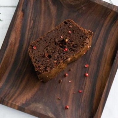 Dense smoked chocolate-and-vanilla fudge cake encrusted with pink peppercorns