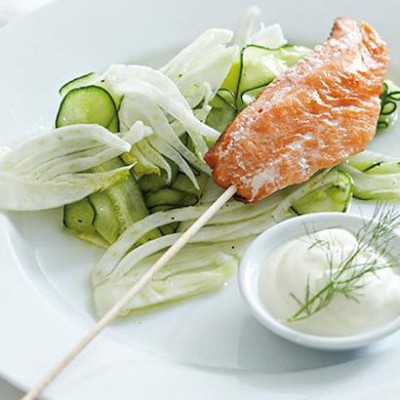 Fish on a stick with shaved fennel and cucumber salad