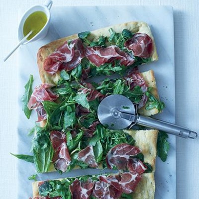 Focaccia with herb salad and torn coppa
