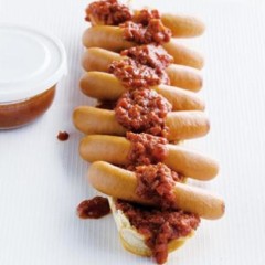 Foot-long hot dogs on crusty baguettes with organic tomato sauce