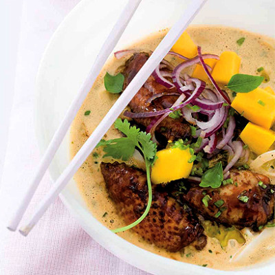Fragrant coconut and sticky chicken wing curry with sweet  mango and noodles