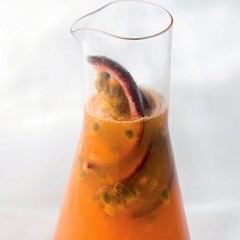 Freshly squeezed carrot juice with granadilla wedges
