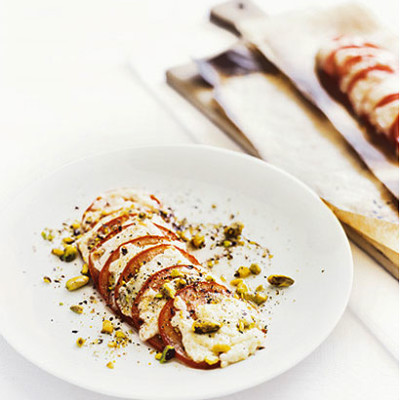 Grilled organic gouda and tomato with white balsamic vinegar and pistachios