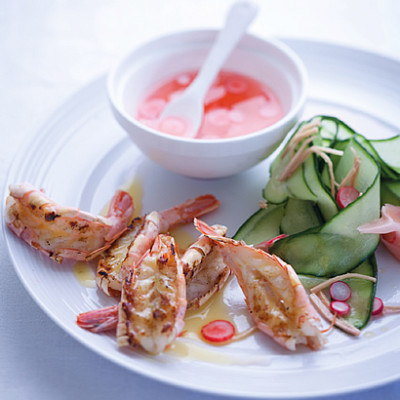 Grilled prawns in lime butter with pickled radish and cucumber salad