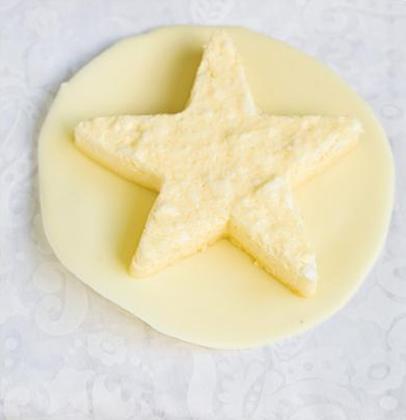 Honeycomb blancmange stars served on a decadent white chocolate plate | Woolworths TASTE