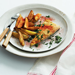 Hummus-topped angel fish with cayenne-dusted potato wedges