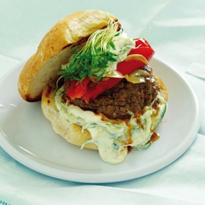 Lamb burger with tzatziki, roasted red pepper and coriander sprouts