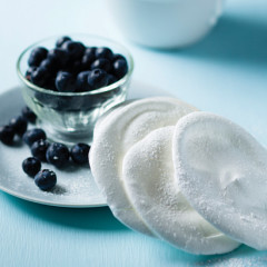 Meringue discs with blueberries and whipped cream
