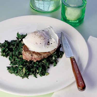 Mini steaks with soft-poached egg on anchovy spinach