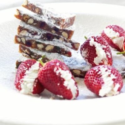 Panforte with chevin-stuffed strawberries