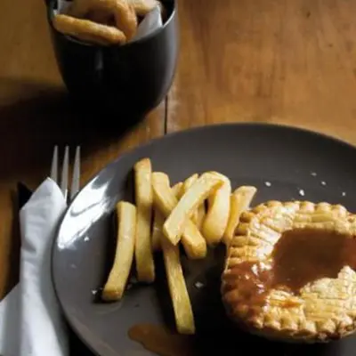 Pie And Chips With Traditional Gravy And Crispy Onion Rings Woolworths Taste