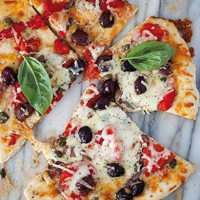 Pizza with mozzarella, olives, anchovies and capers