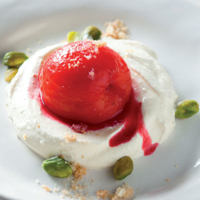 Poached plums with sugar-free biscuit crumble and pistachios