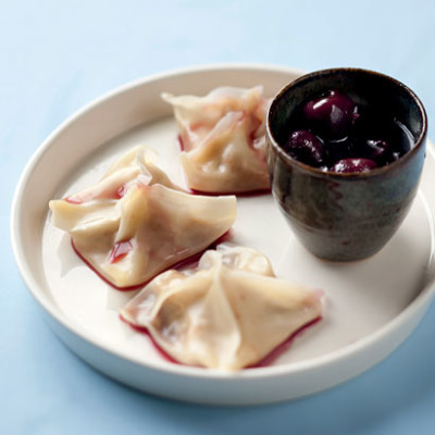 Pork and ginger wontons with cherry dipping sauce