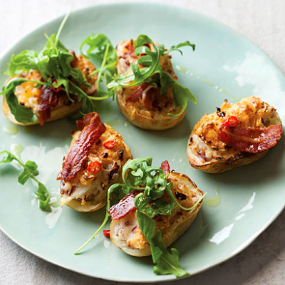 Potato skins stuffed with bacon and rocket