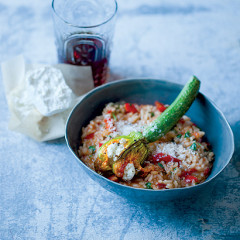 Red pepper risotto with ricotta-stuffed courgette flowers