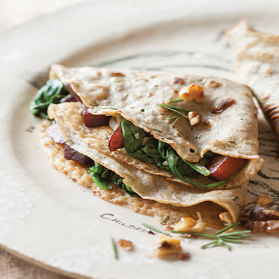 Rosemary buckwheat pancakes with wilted spinach, butternut and apple