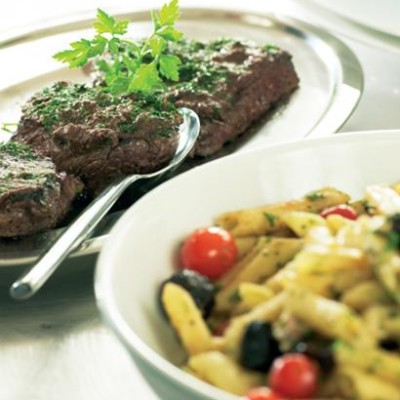 Seared ostrich steaks with tapenade and pasta
