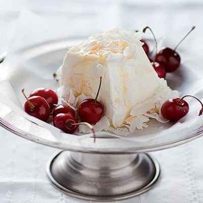 Soft goats cheese with coconut and cherries