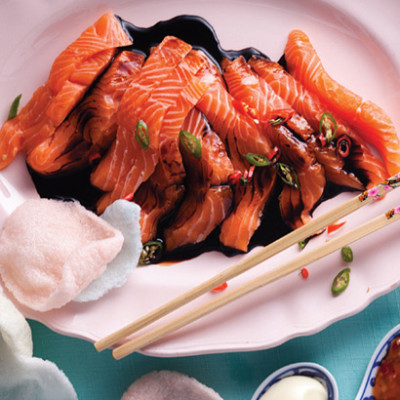 Soya, ginger and chilli dressed salmon sashimi with prawn crackers