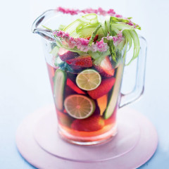 Sparkling lime-infused strawberry sangria pitchers rimmed with fuchsia radish sugar frosting