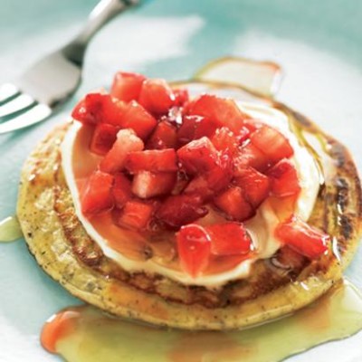 Strawberry salsa on buckwheat blinis with strawberry-infused honey