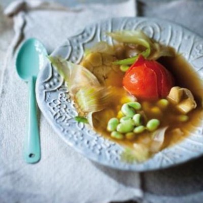 Summer broad bean and poached tomato broth