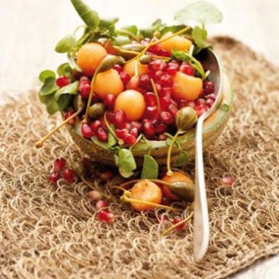 Sweet melon and pomegranate salad with caper berries