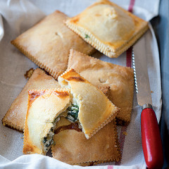 Three-cheese and baby spinach pies